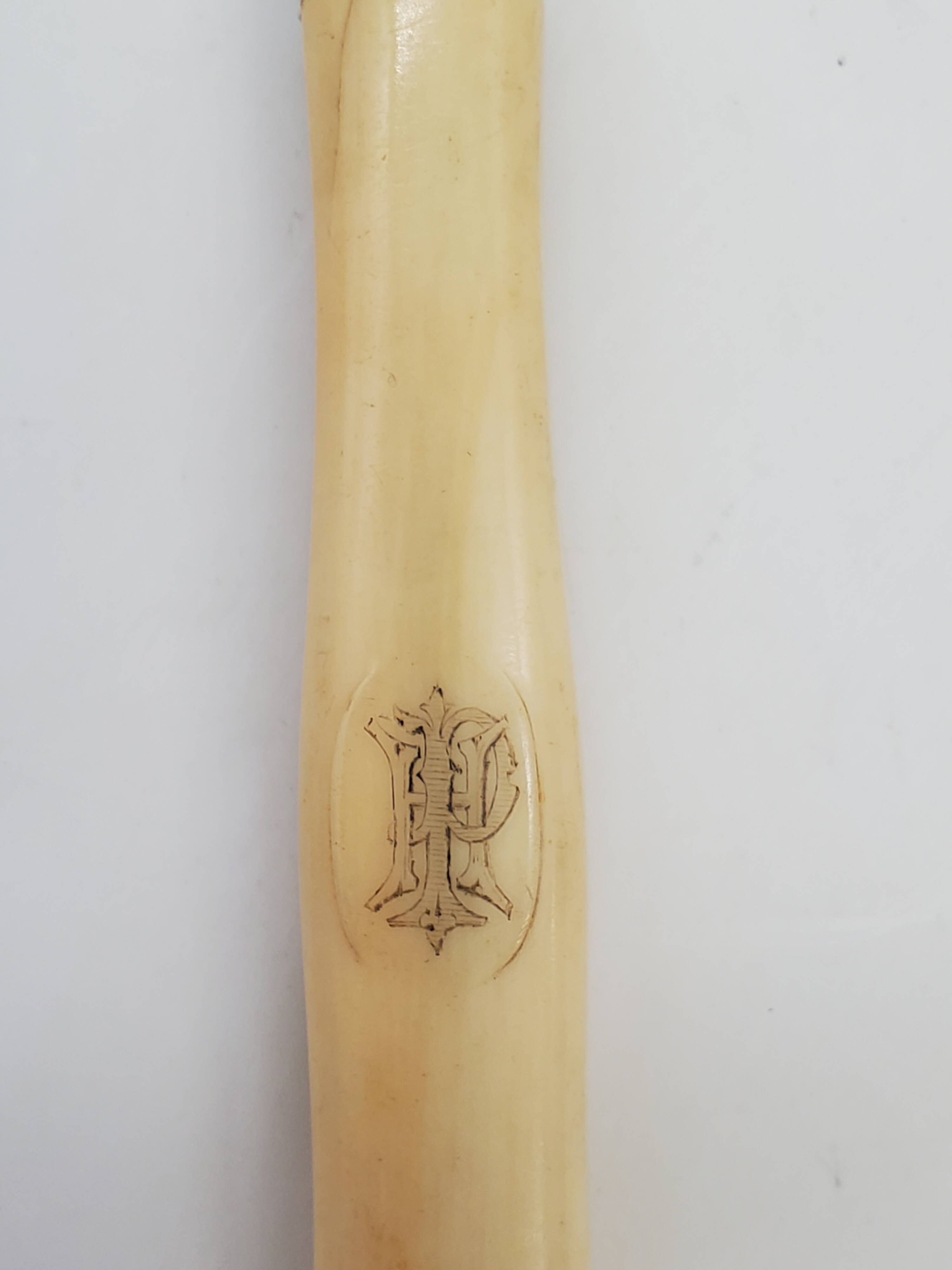 Set of 5 dessert knives with ivory handles.