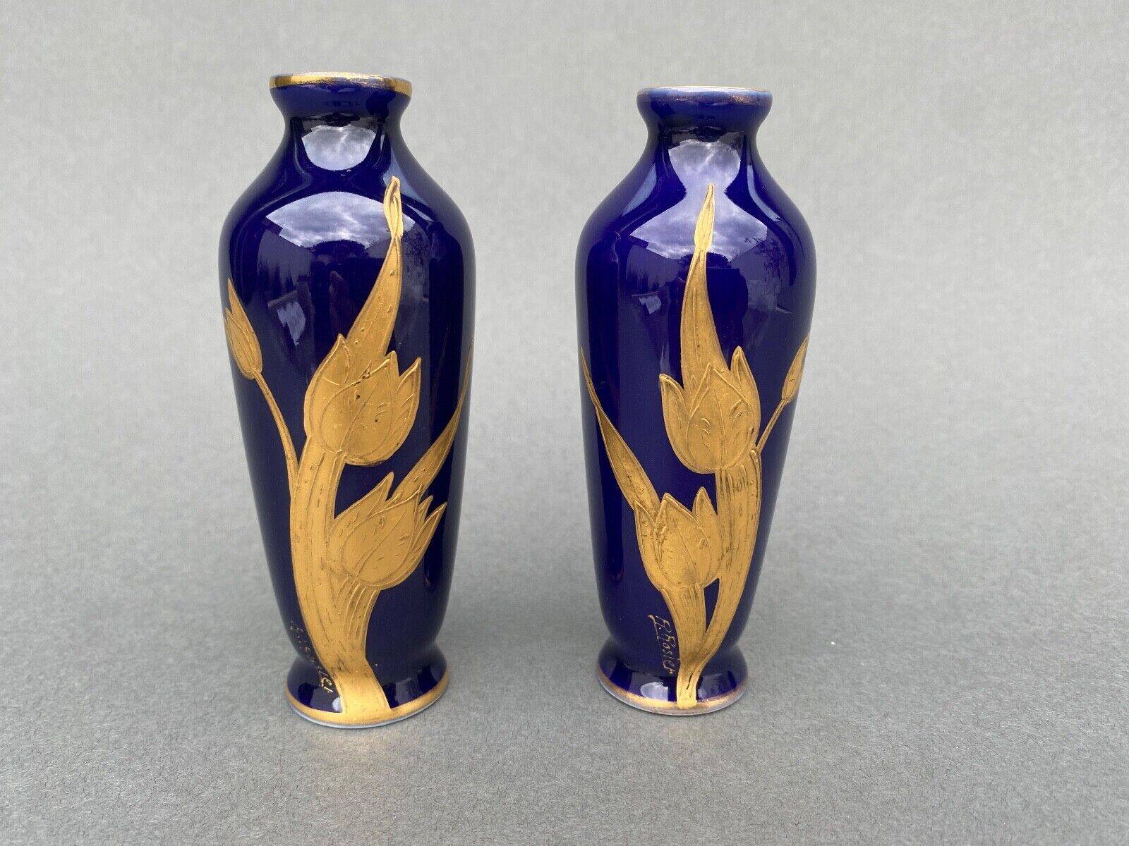 Pair of 1900 Limoges vases with blue background and gold highlights, R. Rosier decorations