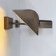 Pair of vintage adjustable wall lights, patinated brass, France 1970.