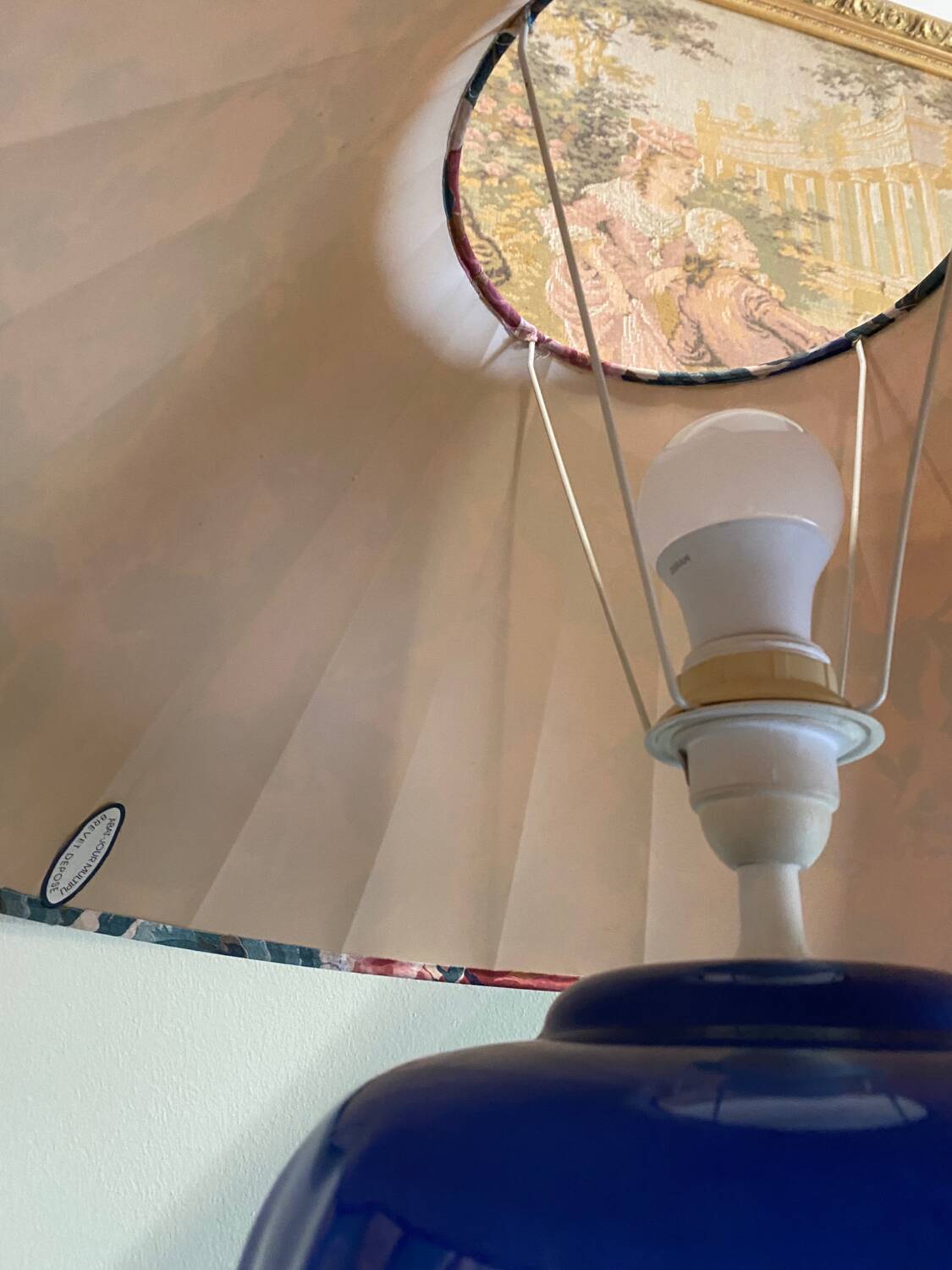 Large blue ceramic lamp with floral shade