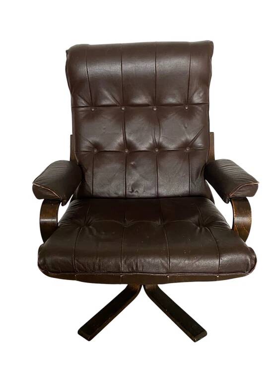 Scandinavian rocking and swivelling armchair – bent wood and leather