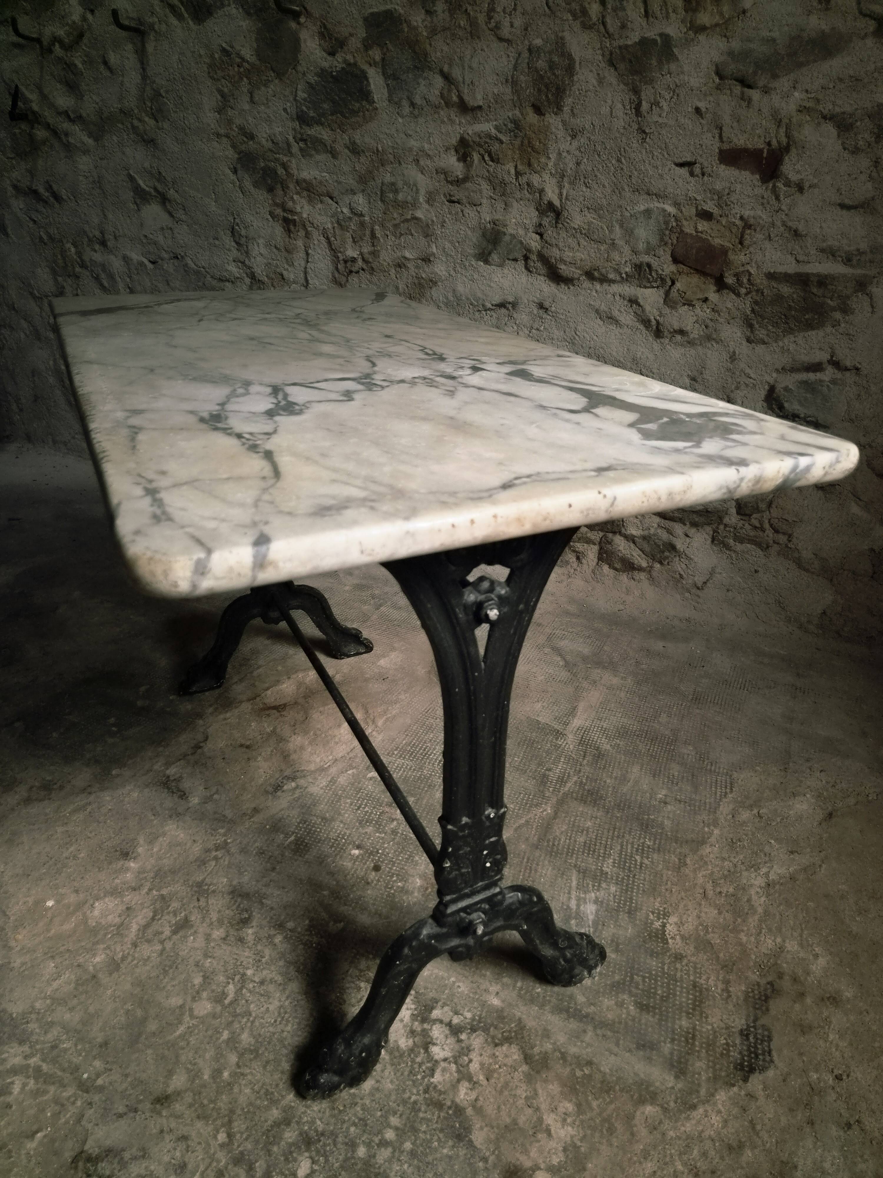 French bistro table made of marble with a cast iron base, 1920s–1930s.