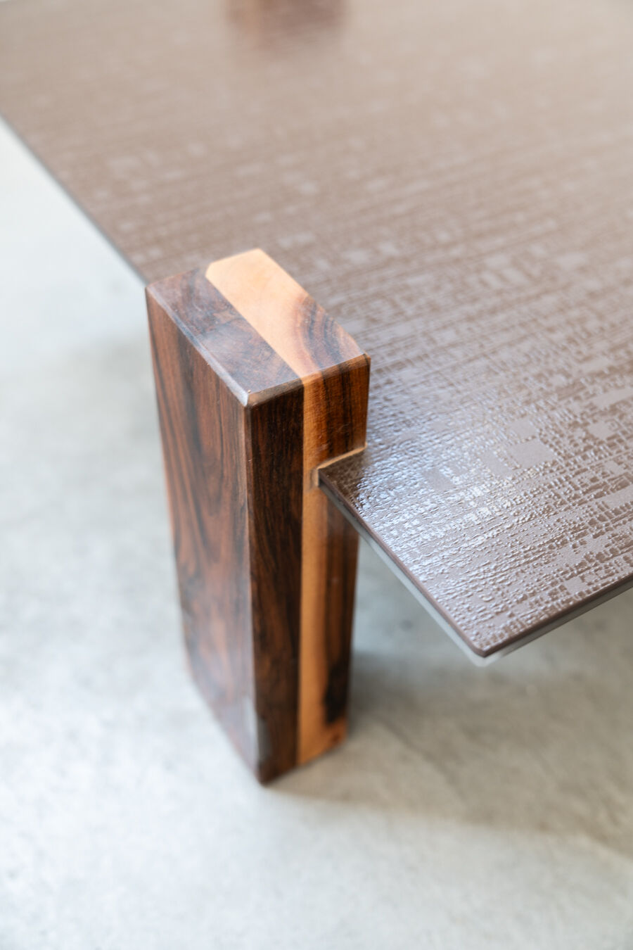 Handcrafted coffee table with ceramic glass top and walnut legs