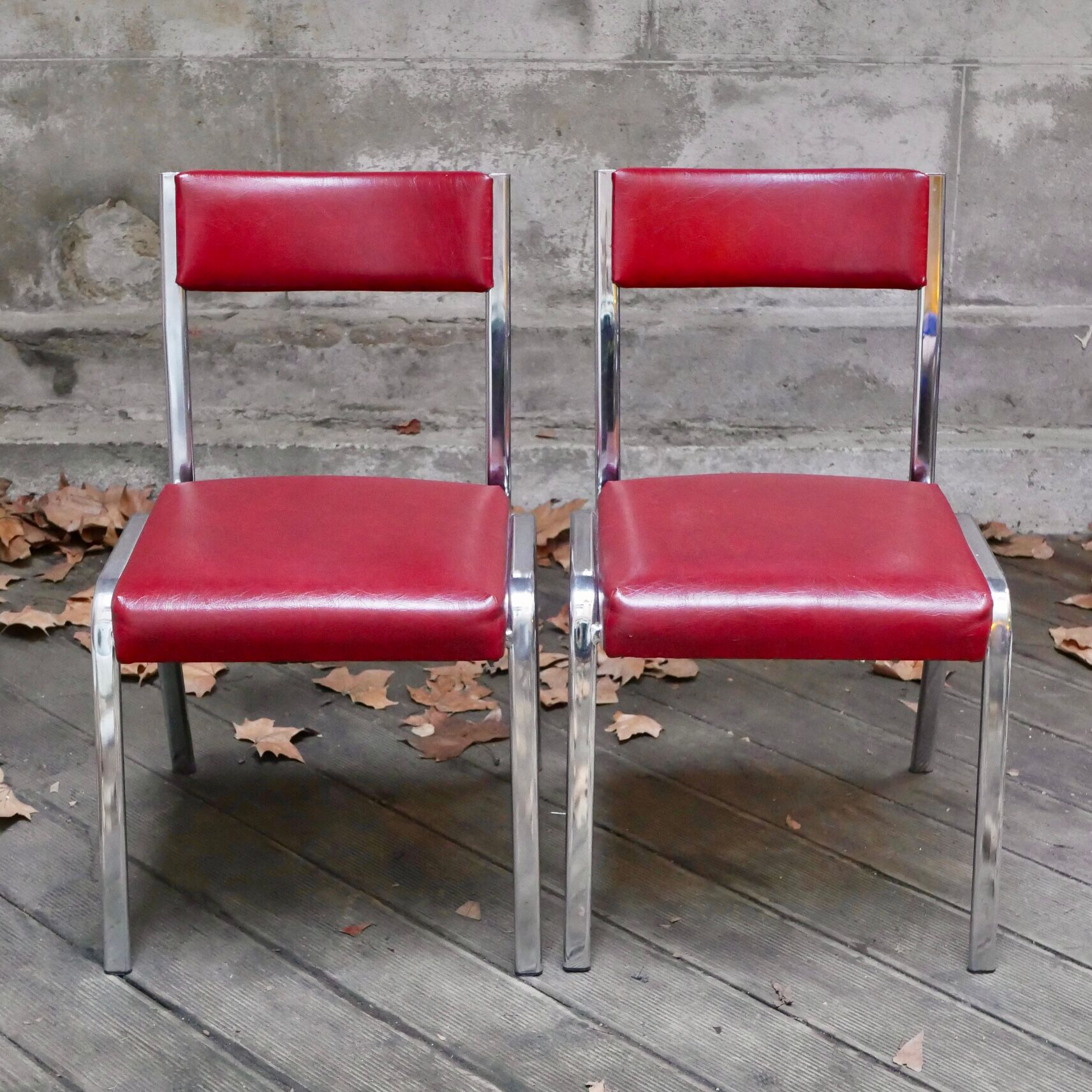 Pair of red leatherette chairs