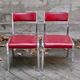 Pair of red leatherette chairs
