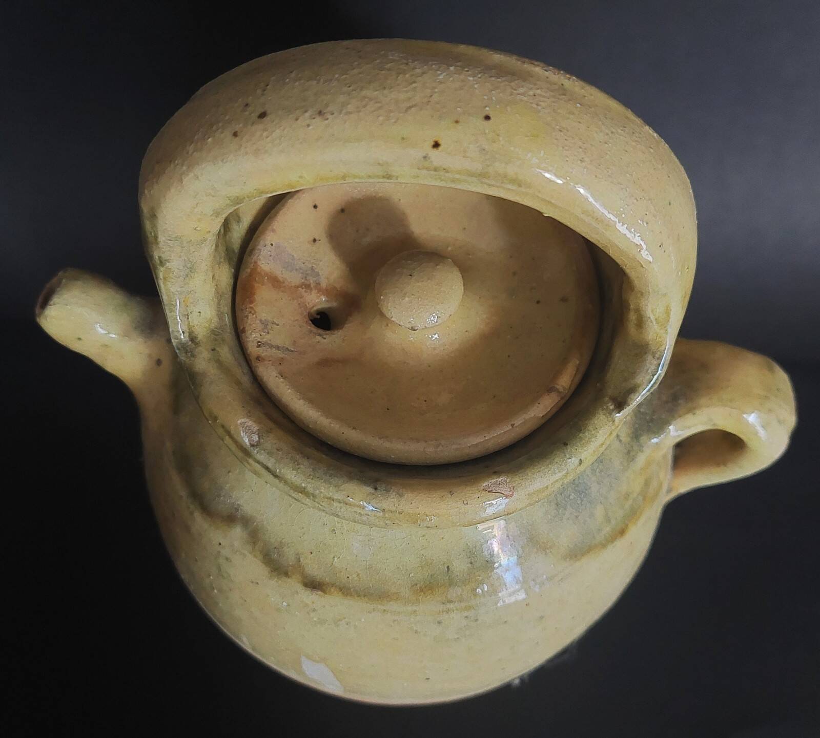 Yellow glazed terracotta gargoulette carafe with lid, early 20th century.