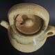 Yellow glazed terracotta gargoulette carafe with lid, early 20th century.
