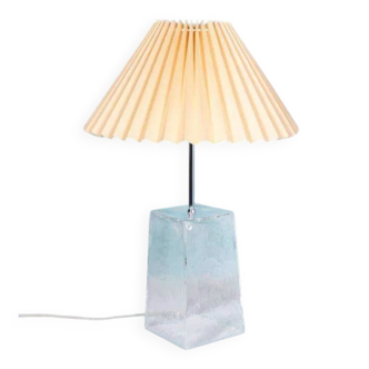Minimalist glass table lamp from the 80s with a pleated shade.