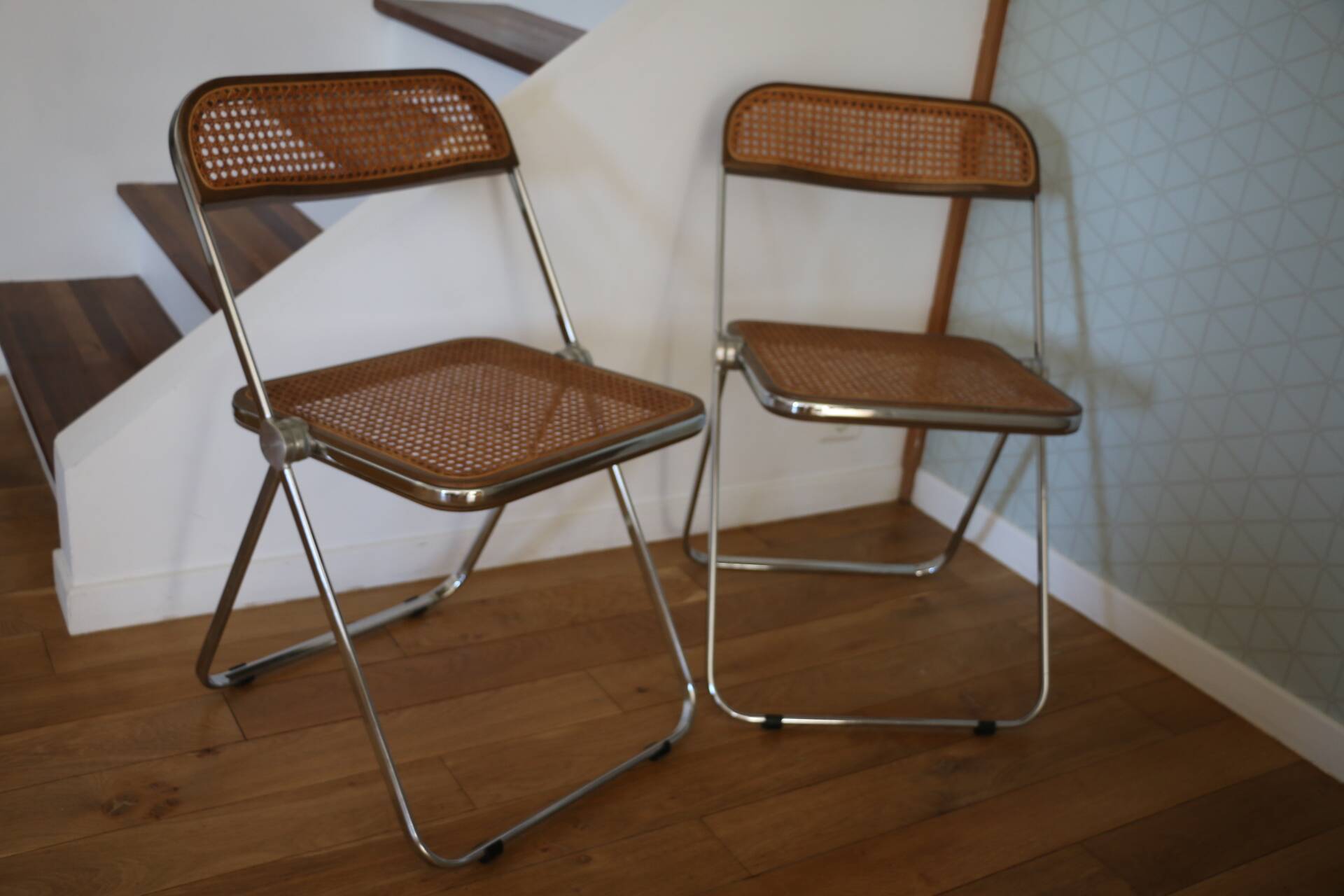 2 plia rattan chairs by piretti