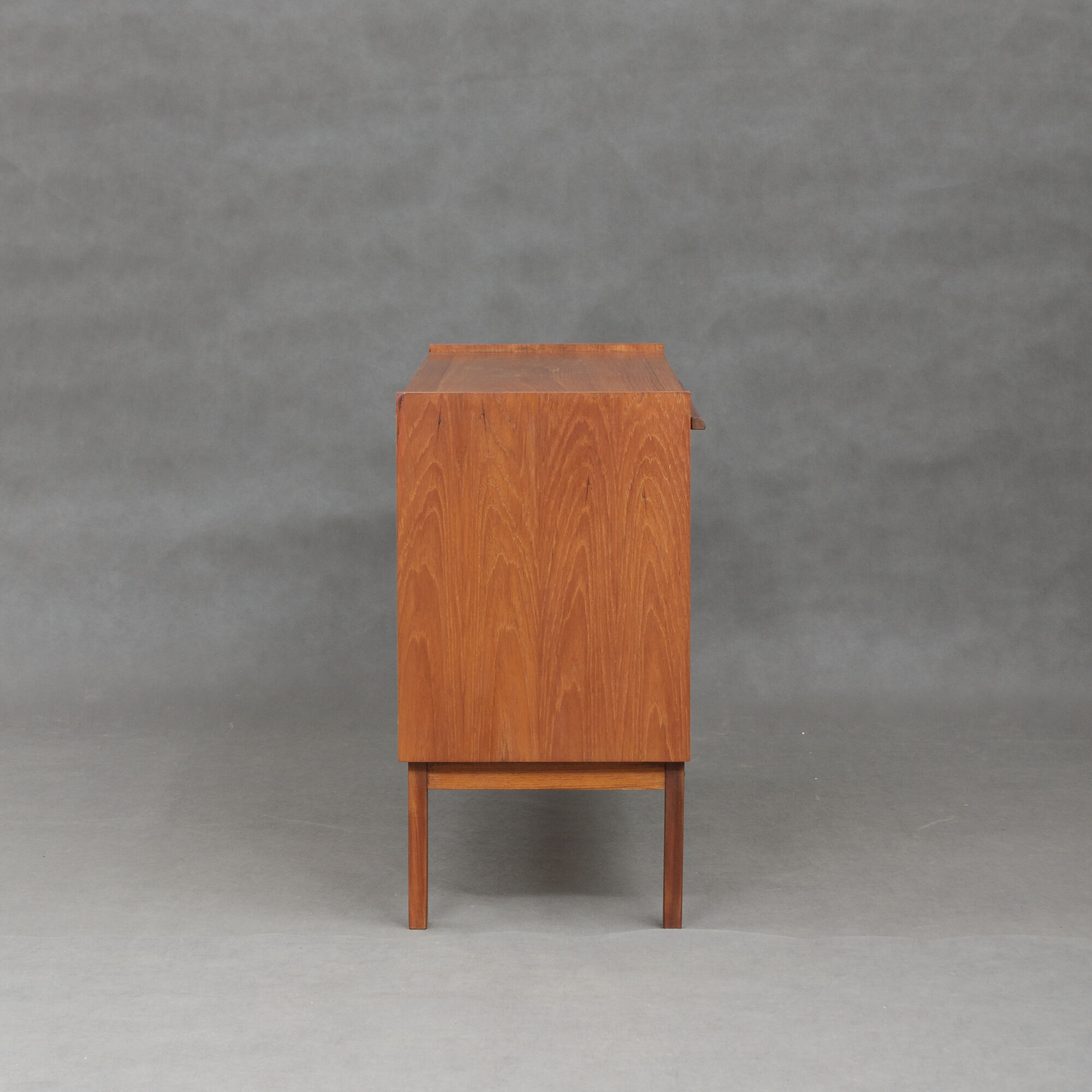 Small Danish teak sideboard with a pull out tray