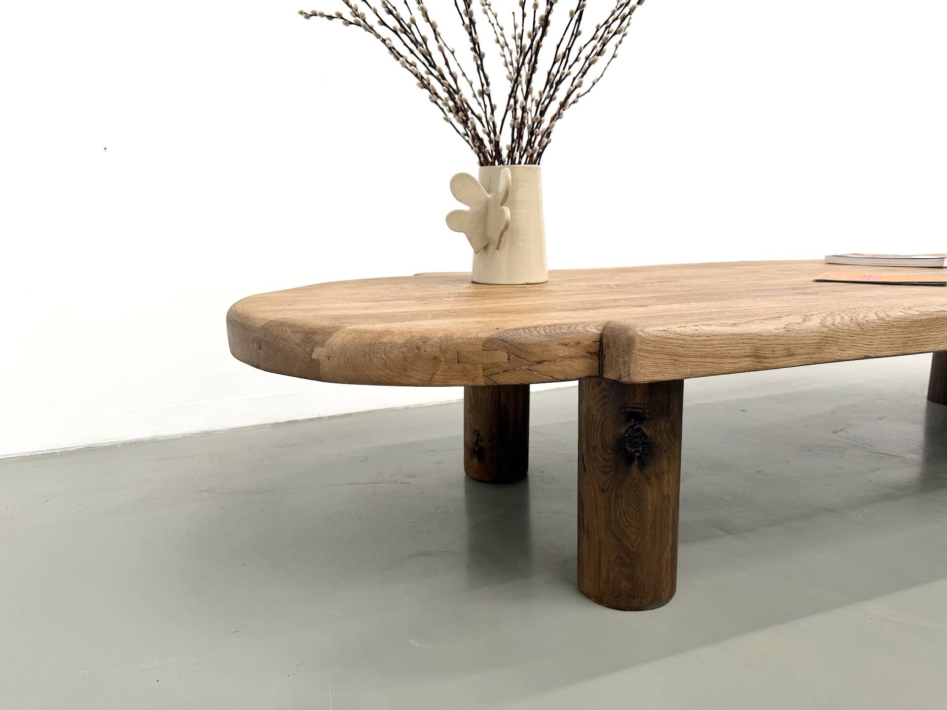XXL oval coffee table in solid oak, cylindrical base, 1950s.