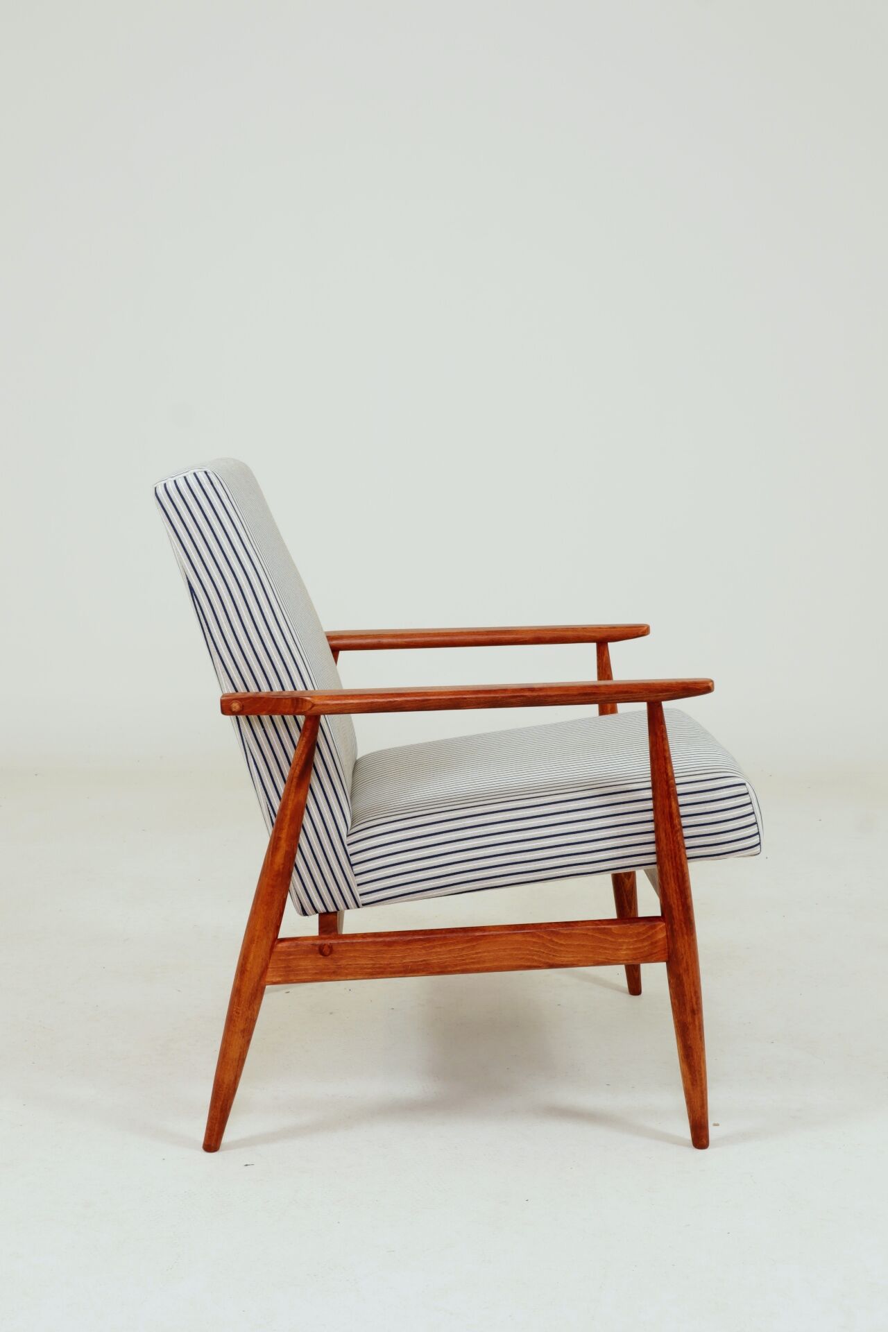 Armchair with striped fabric footrest, 1960