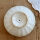 Old ivory ceramic bowl with double green trim.
