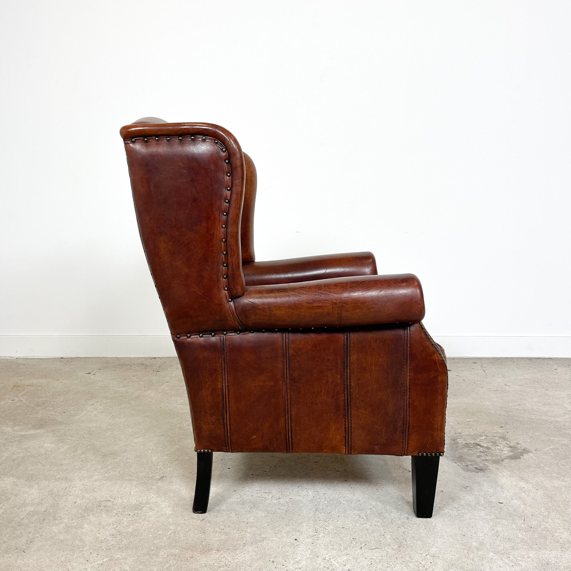 Vintage sheep leather wingback armchair by Lounge Atelier