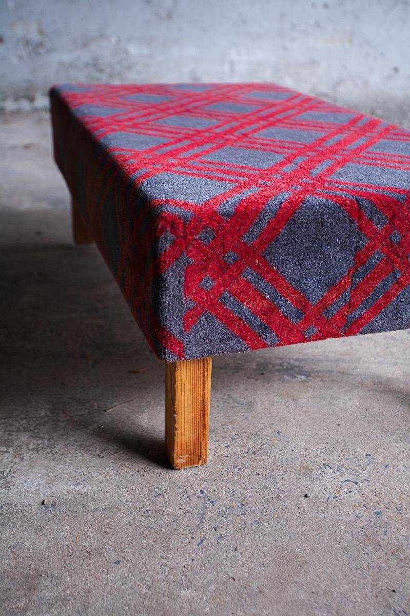 Large vintage bench upholstered in Scottish tartan fabric.