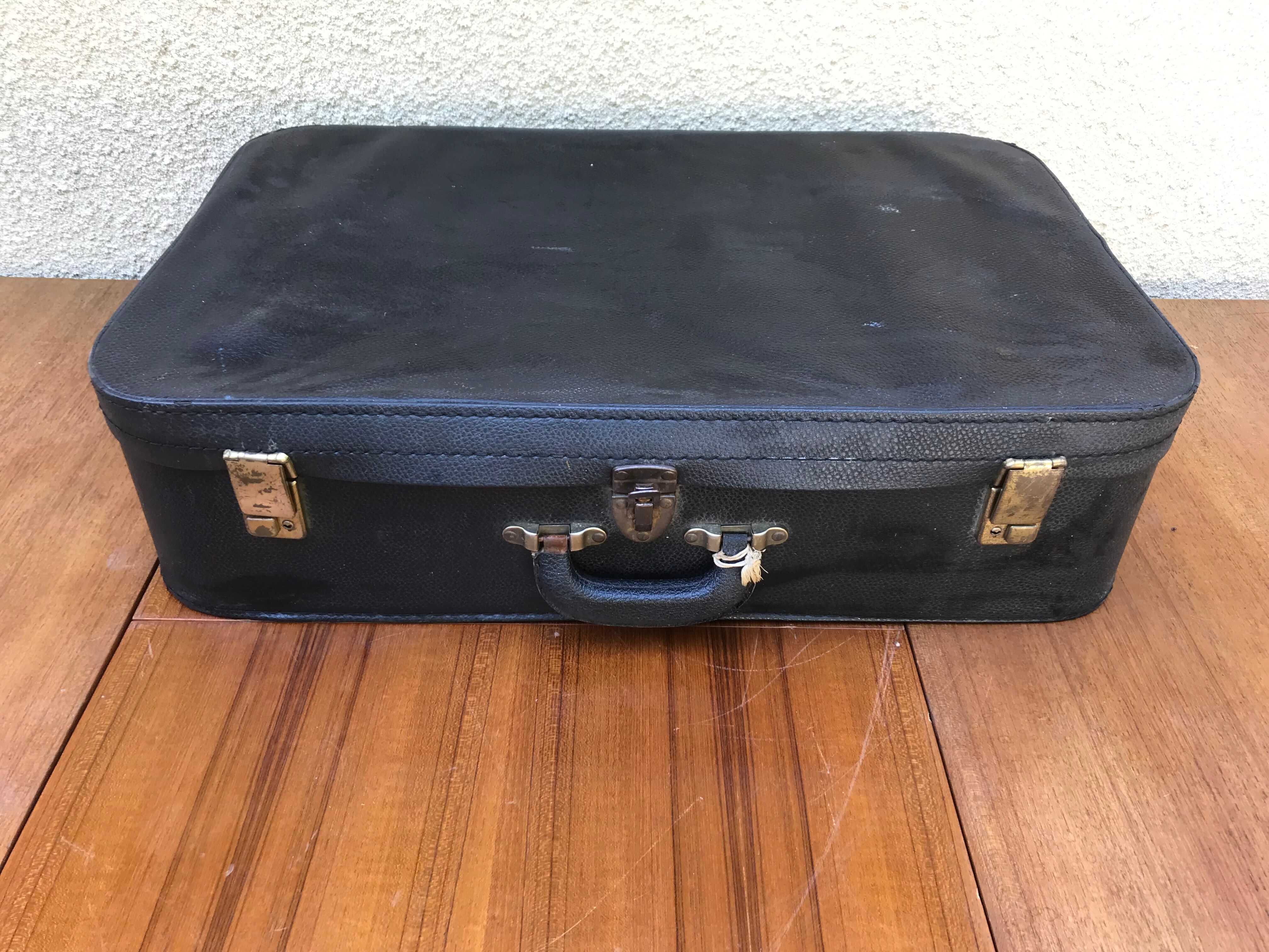 Former skai black travel suitcase