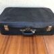 Former skai black travel suitcase