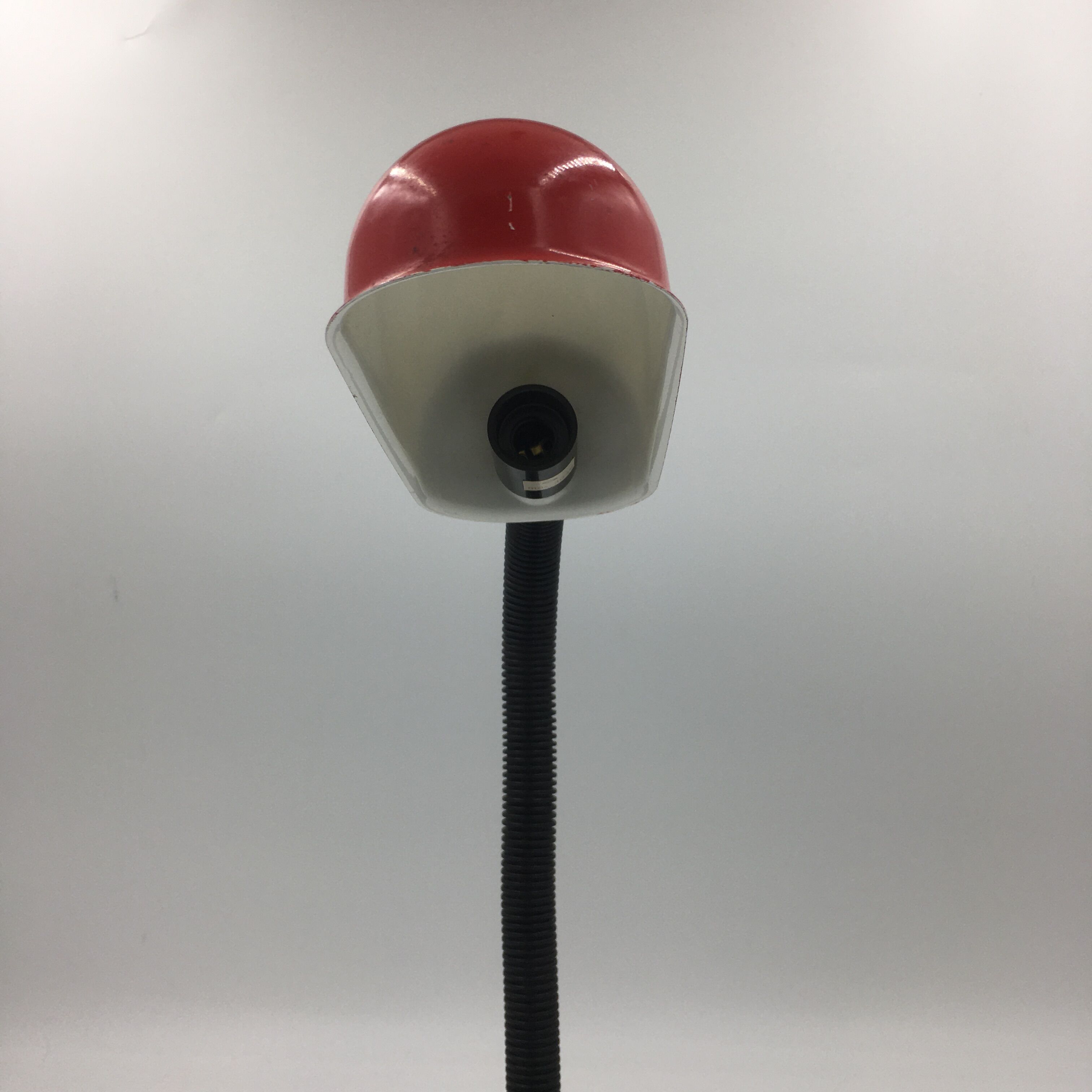 Duo of red and black flexible desk lamps with pencil holder