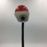 Duo of red and black flexible desk lamps with pencil holder