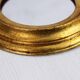 Golden oval mirror