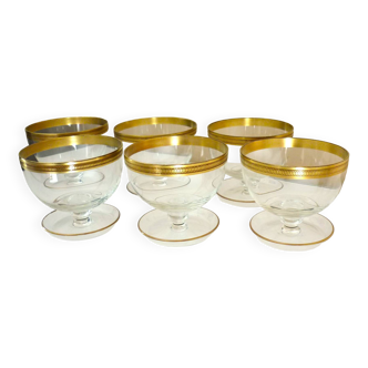 Series of 6 glasses, bowls on curved legs, raised in fine crystal and gilding