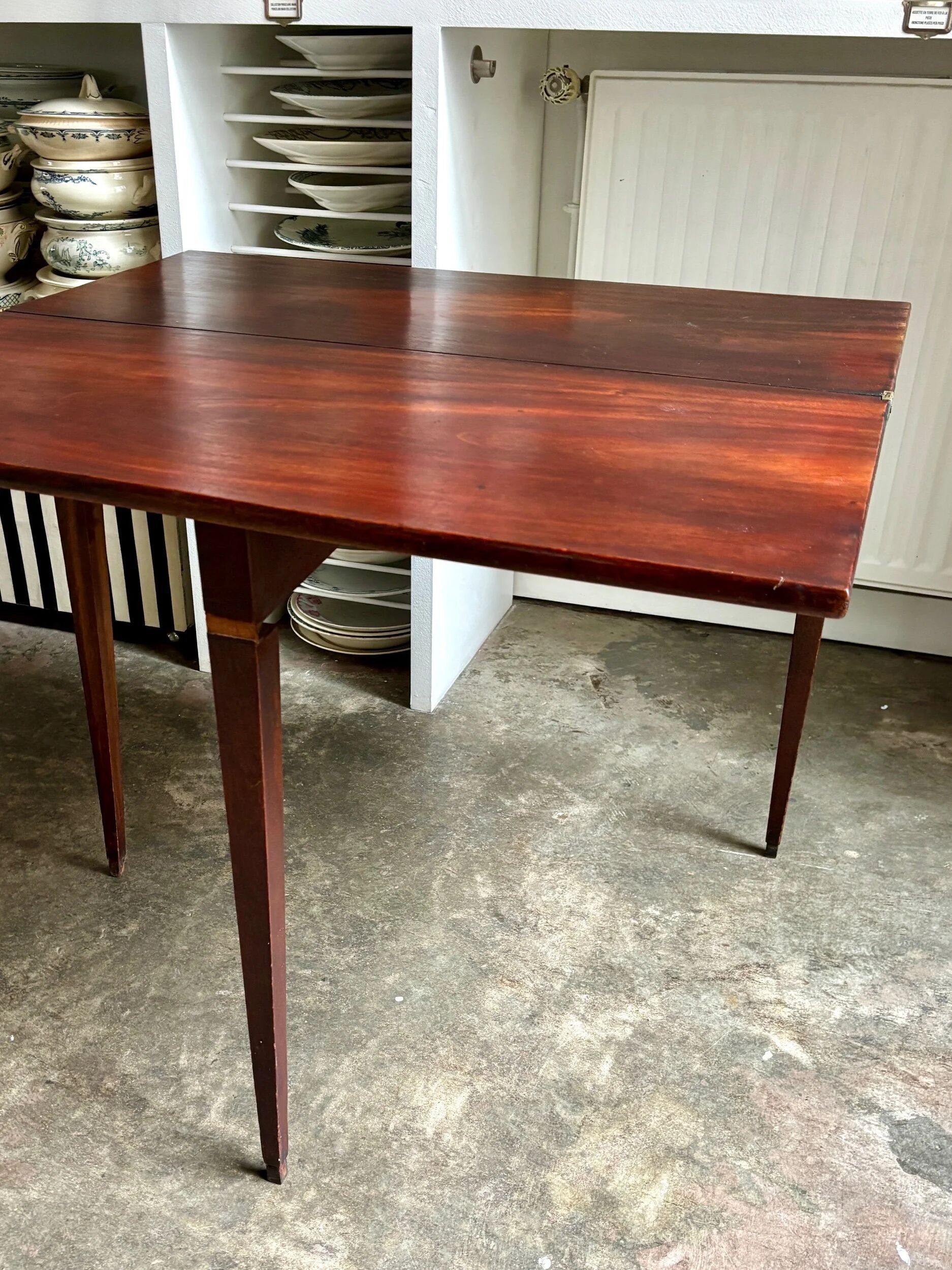 Folding table, dark wood console.