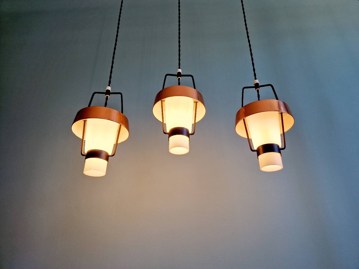 Trio of Scandinavian pendant lights in opaline and copper metal, 1960s