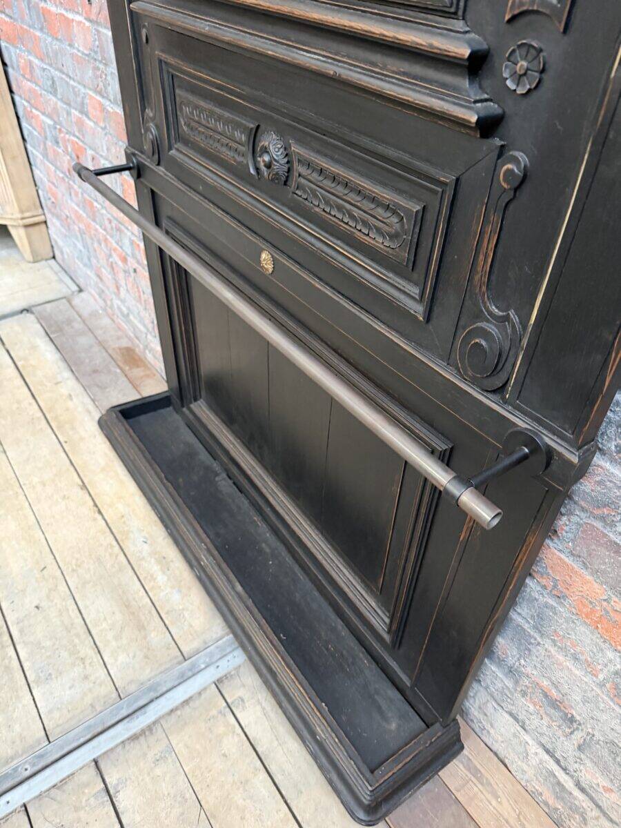 Patinated oak wardrobe from the early 20th century.