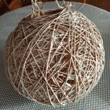 Globe suspension made of twine and wicker