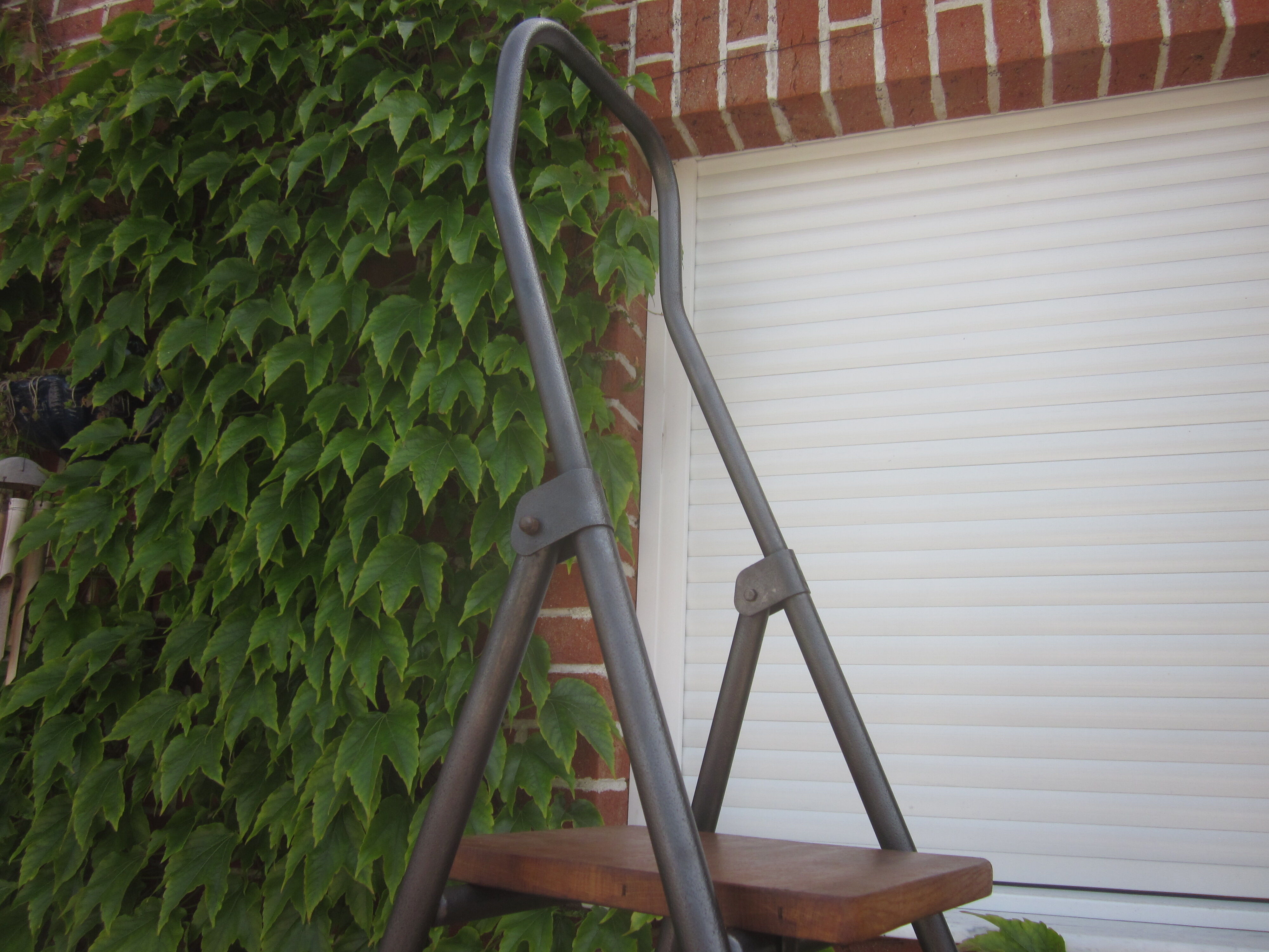 Old stepladder in metal and wood