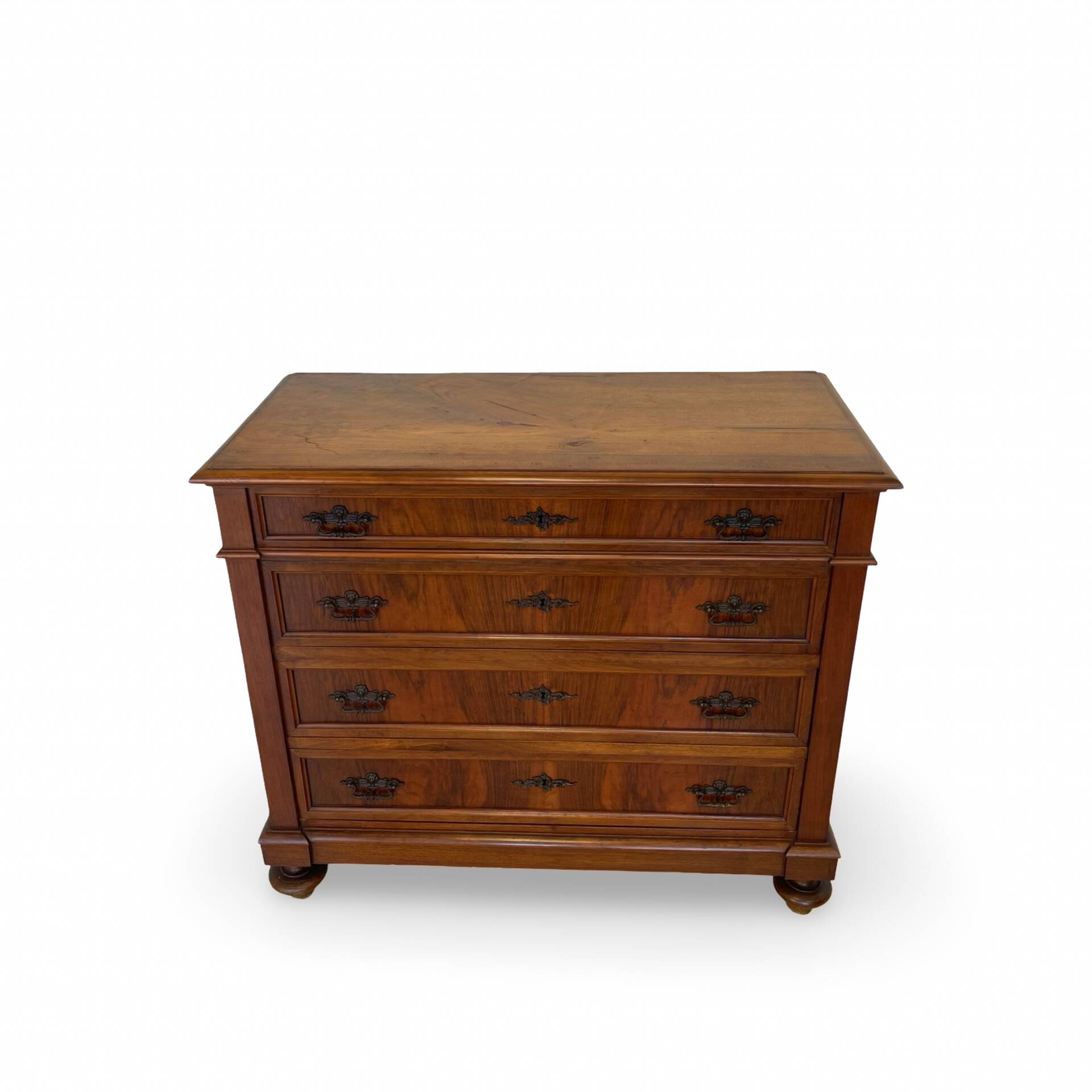 Antique walnut commode with bronze handles in the shape of a lion's mask,