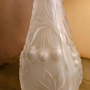 Frosted transparent glass carafe with raised cherry and grape patterns.