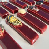Set of vintage red ceramic knife holders, marine motif, retro style