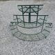 Old half-moon wrought iron plant holder