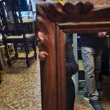 Mirror in golden wood