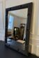 Patinated black rectangular wooden mirror