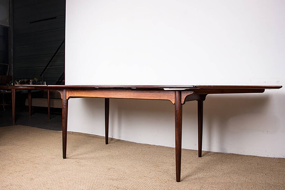 Danish extendable dining table in rosewood, model 54 by Gunni Omann