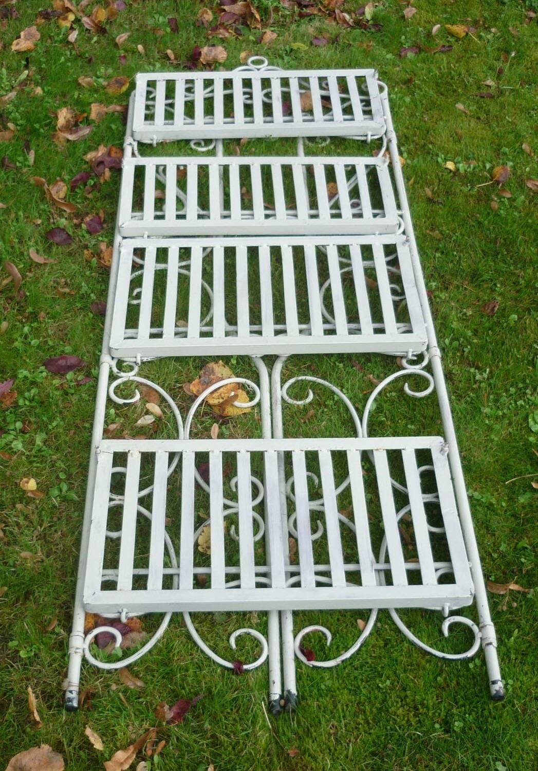 White wrought iron folding shelf