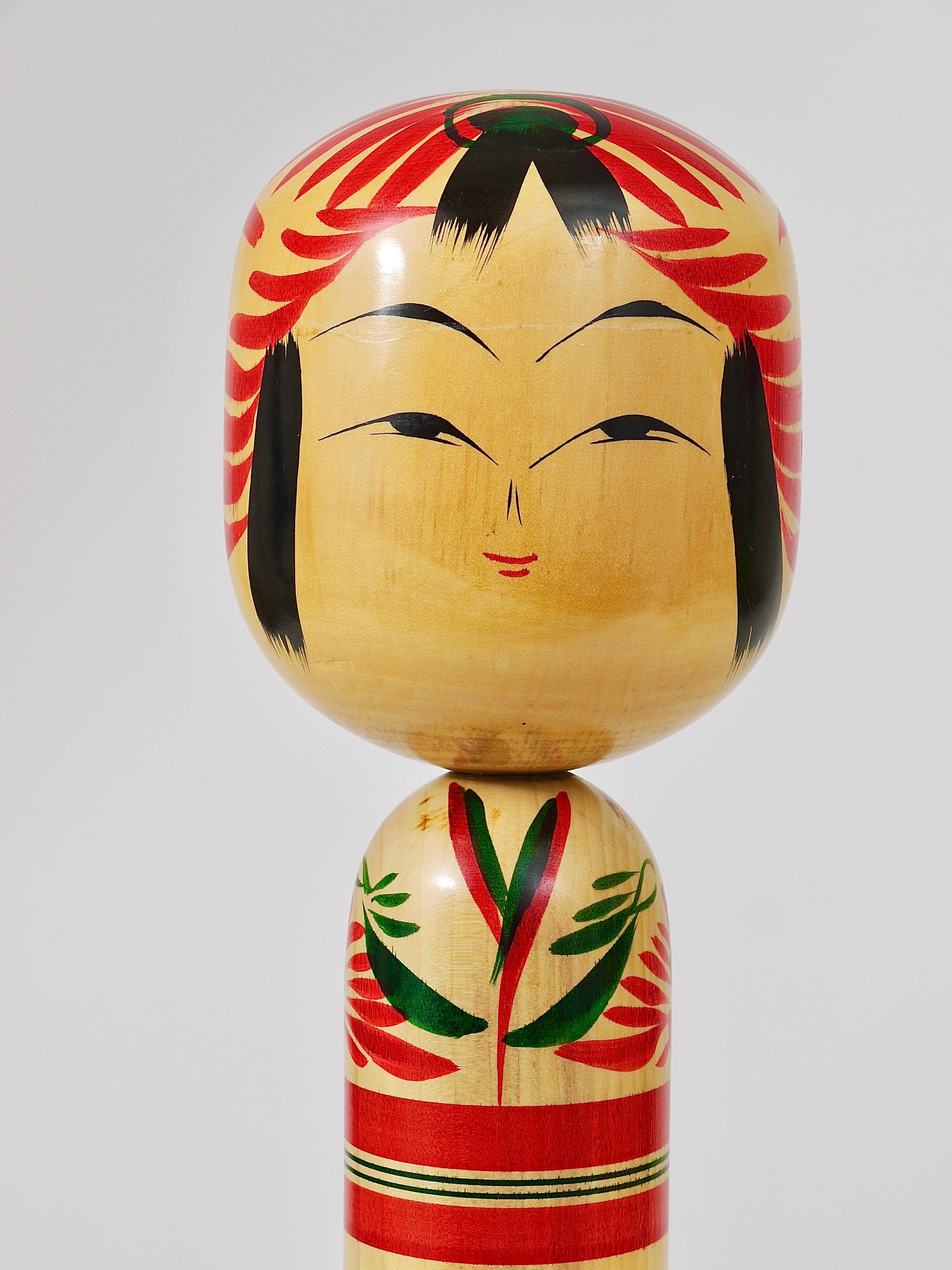 Decorative Kokeshi doll sculpture from northern Japan, hand-painted, signed.