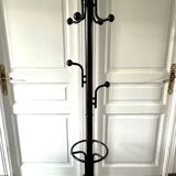 Black metal parrot coat rack on marble base