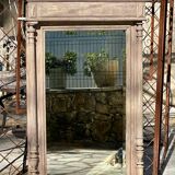 Imposing fireplace mirror in carved and painted wood, 19th century.