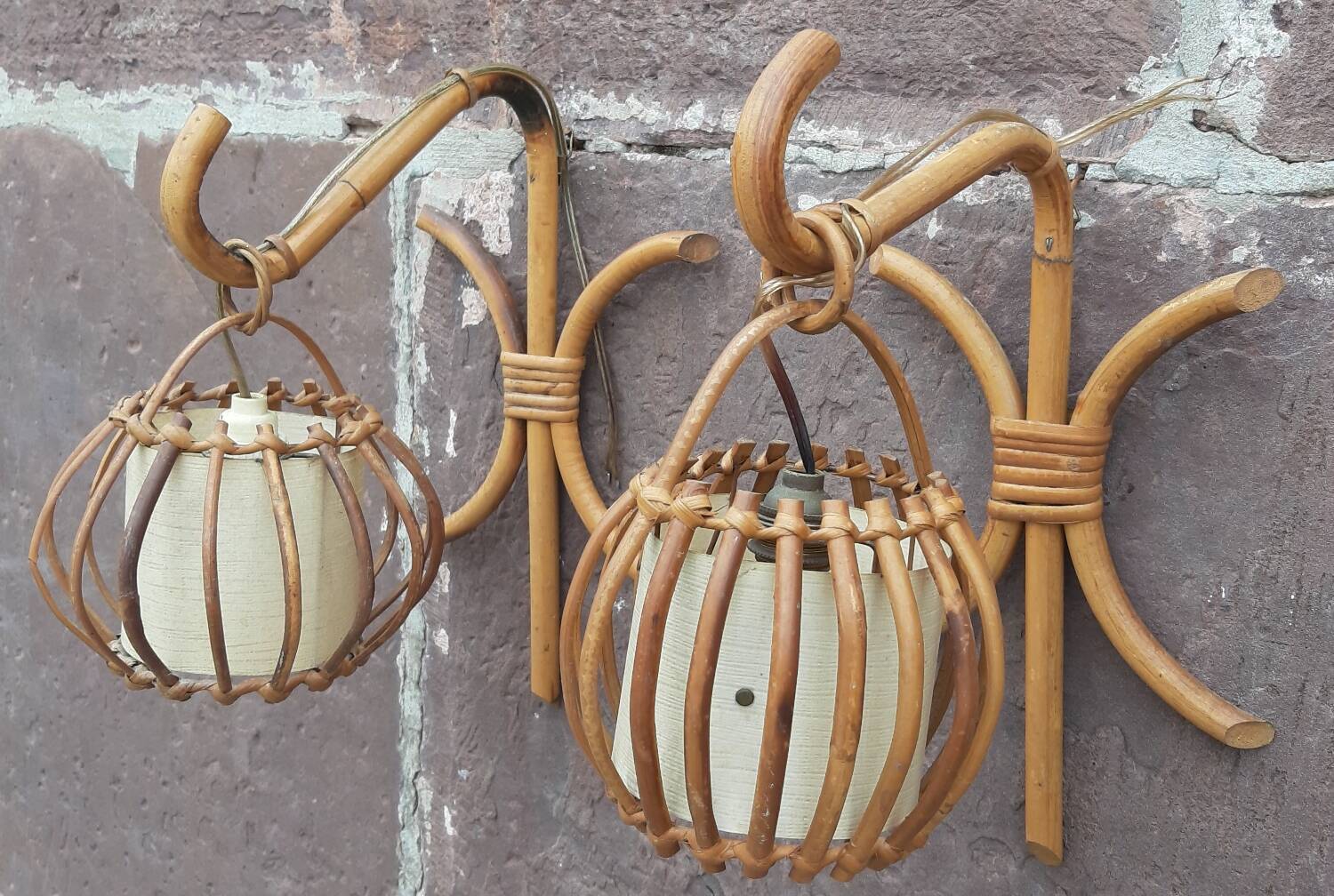 Pair of Louis Sognot rattan wall lights.