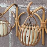 Pair of Louis Sognot rattan wall lights.