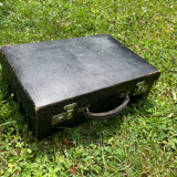 Black leather suitcase beige interior with key