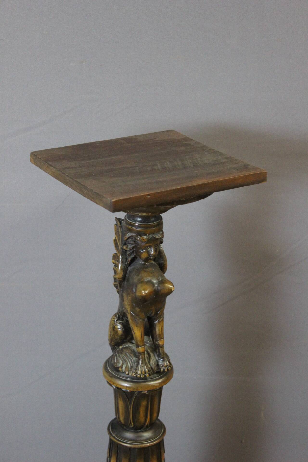 Presentation column with a carved Sphinx decoration from around 1900.