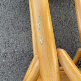 Curved wooden bar stool