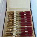 Twelve bakelite handle cake forks