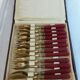 Twelve bakelite handle cake forks