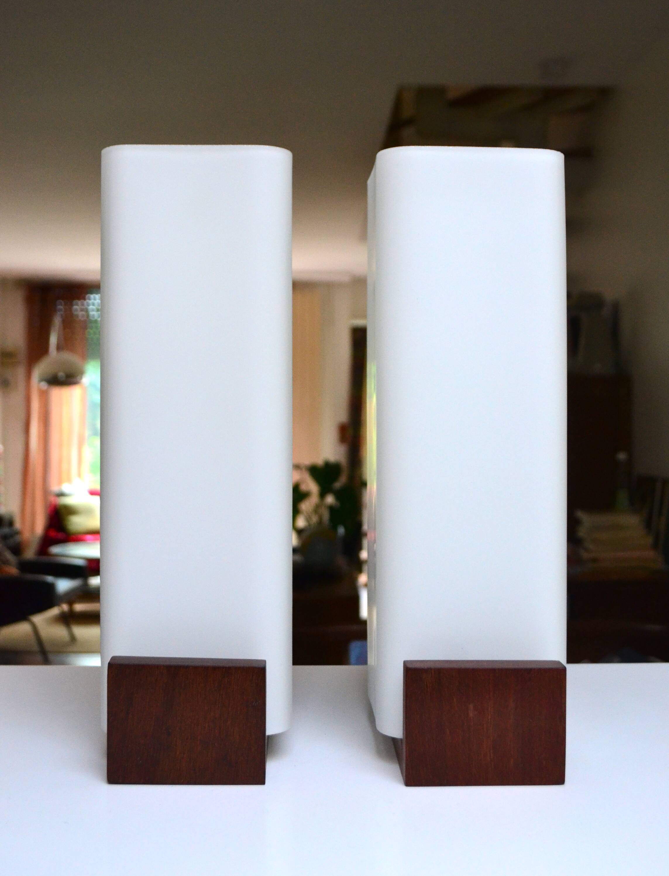 Pair of Louis Kalff wall lights, teak opalines from the 50s/60s.