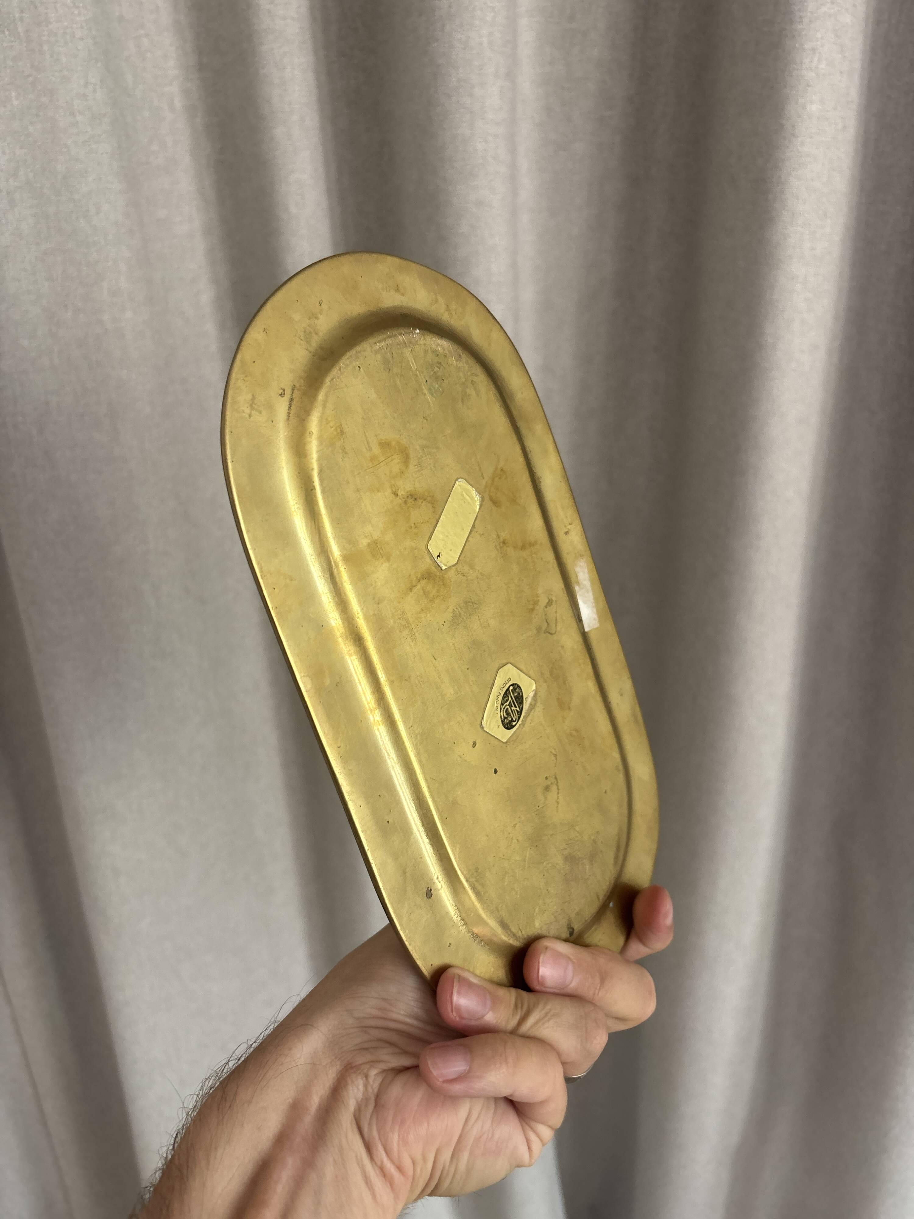 Empty pocket ensemble and bowl in solid brass signed Giò Lanciani.